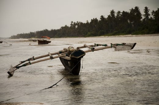 Fishing boat on water of river in Zanzibar