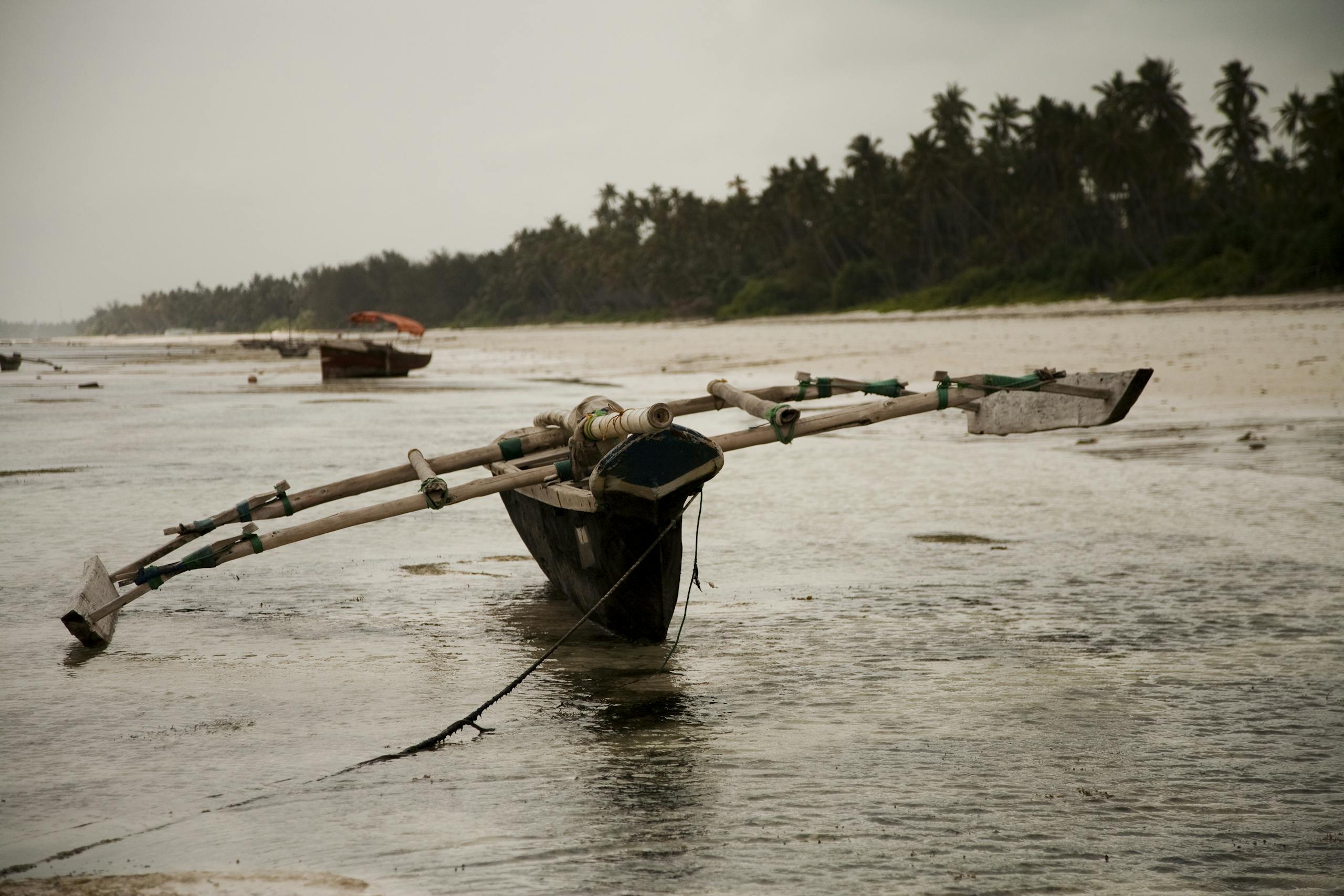 Fishing boat on water of river in Zanzibar